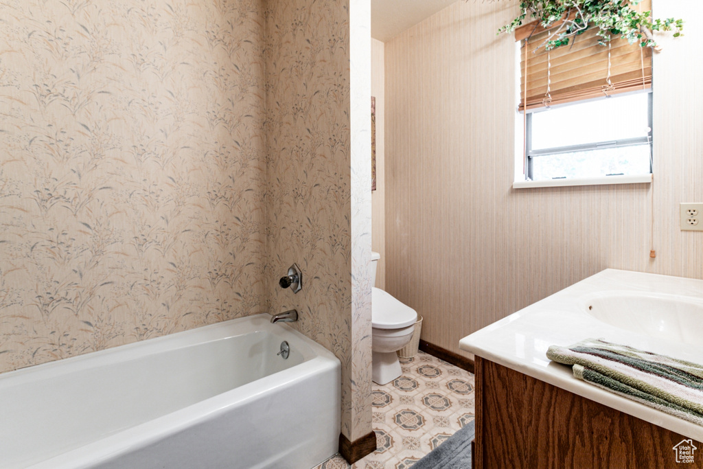 Bathroom with vanity and shower / bathtub combination