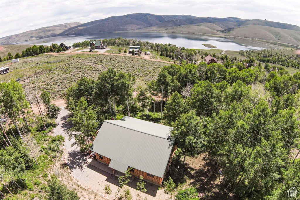 View from above of property featuring a water and mountain view
