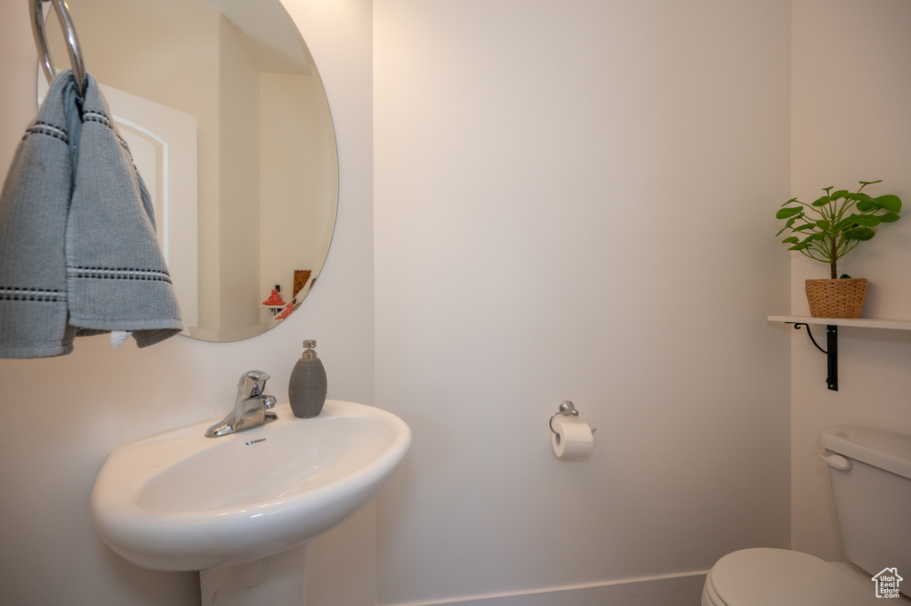 Bathroom featuring a sink and toilet