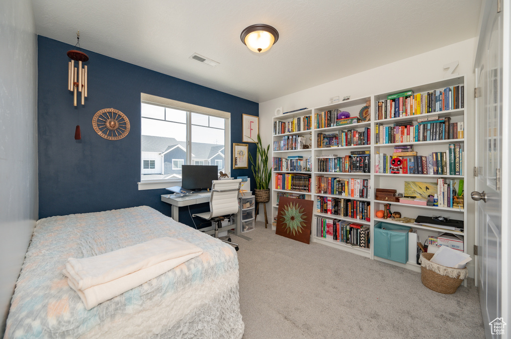 Bedroom featuring carpet