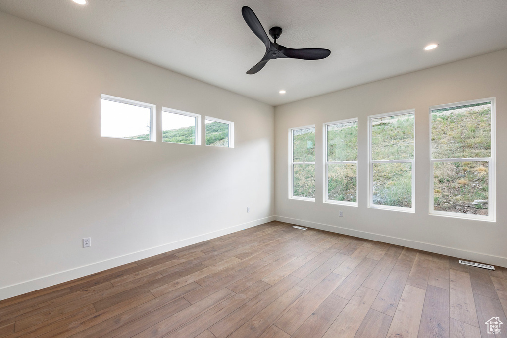 Spare room featuring a ceiling fan, wood finished floors, and recessed lighting