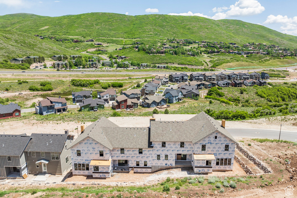 Aerial perspective of suburban area with a mountainous background