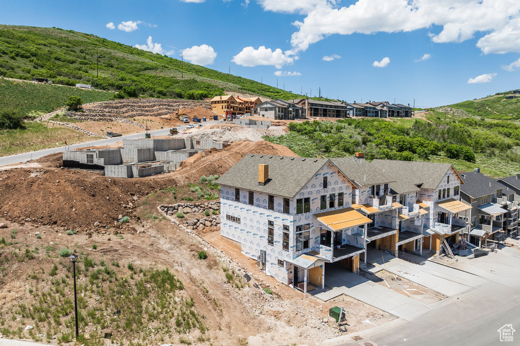 Aerial perspective of suburban area with a mountain backdrop