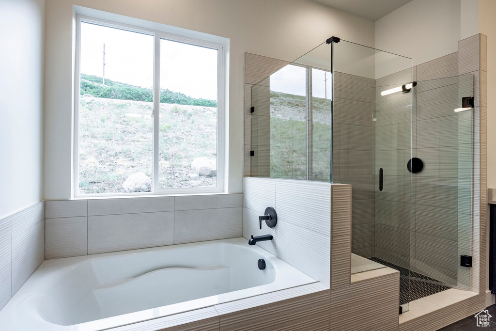 Full bath with a stall shower and a garden tub