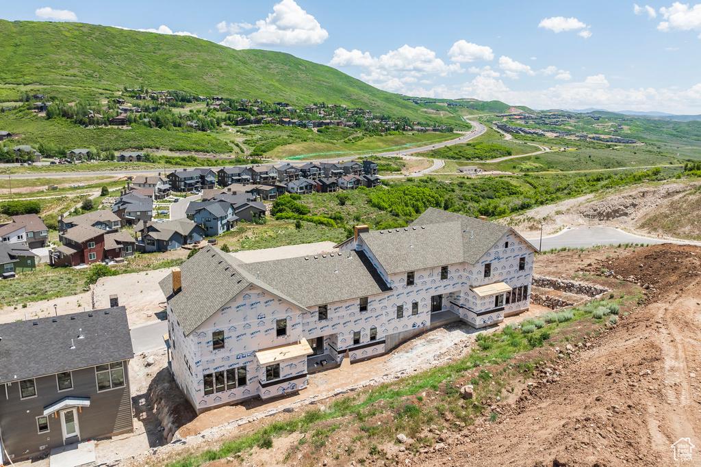 Aerial view of residential area featuring a mountain backdrop