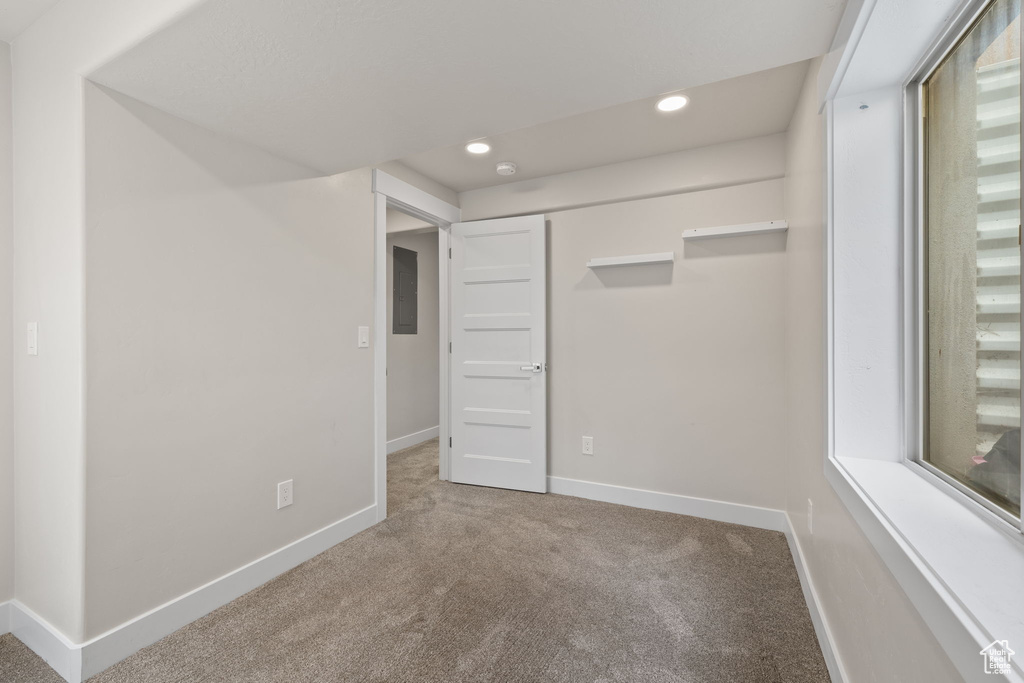 Unfurnished bedroom featuring carpet floors, recessed lighting, and a closet