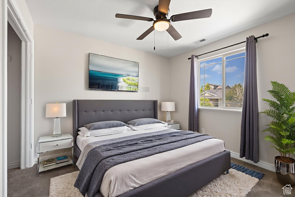 Bedroom with carpet and ceiling fan