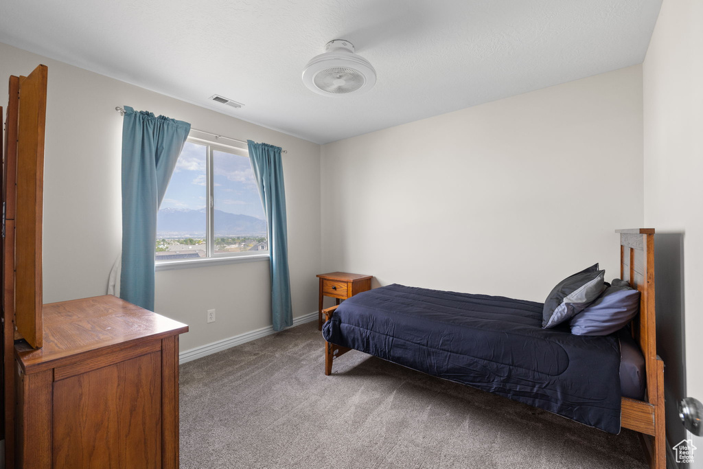Carpeted bedroom with baseboards