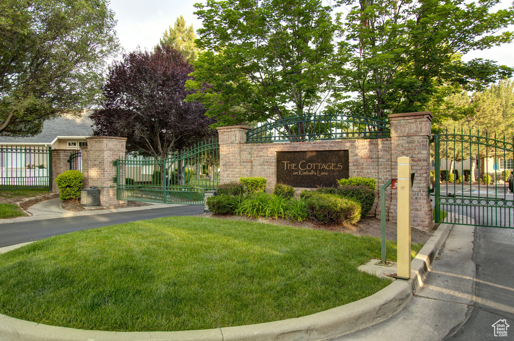 Community sign featuring a gate