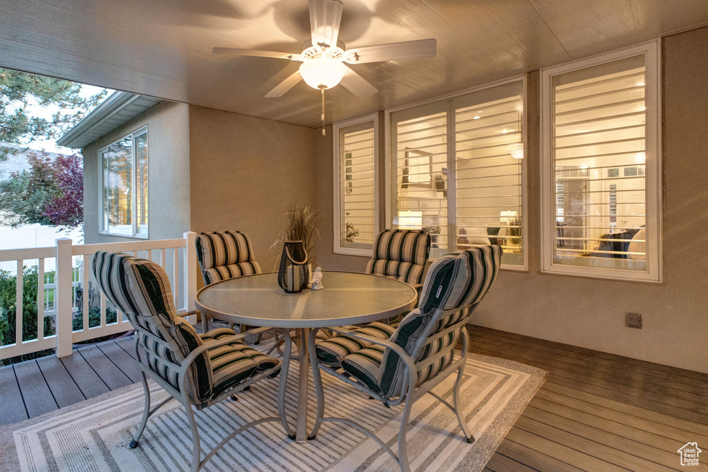 Dining area featuring hardwood / wood-style flooring, plenty of natural light, and a ceiling fan