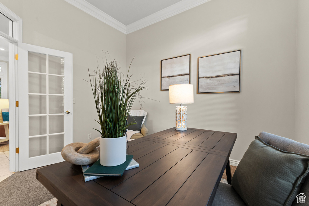 Office space with ornamental molding and carpet floors