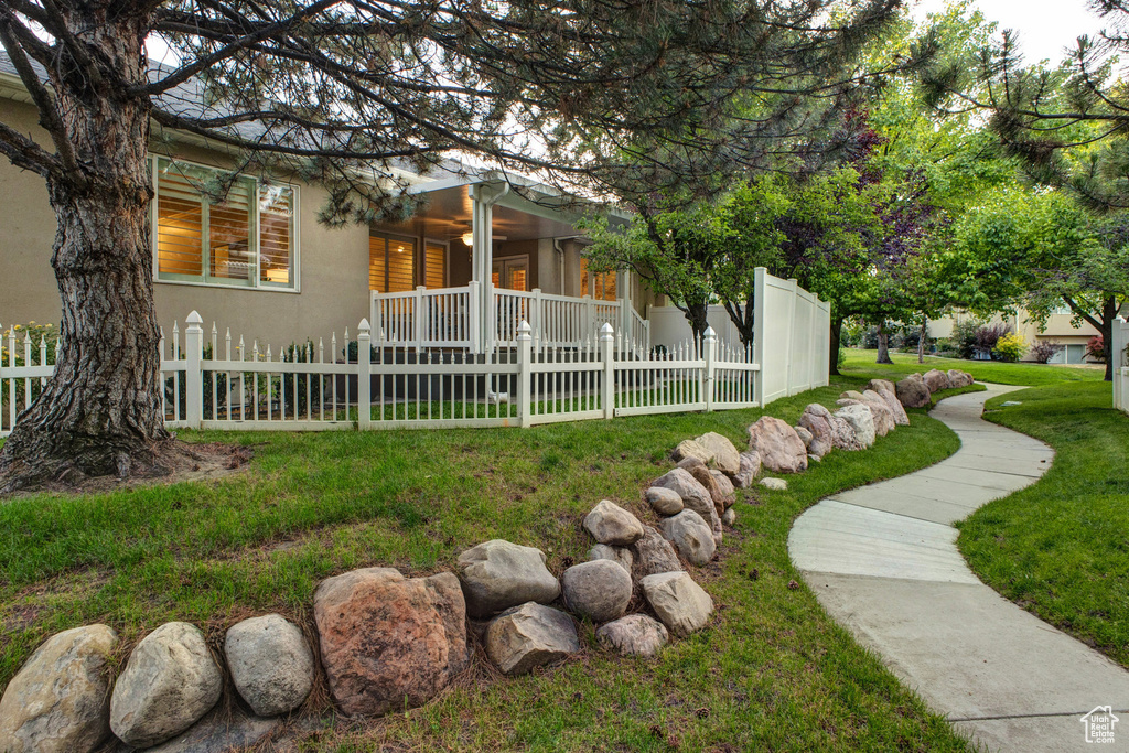 Fenced front yard with covered porch