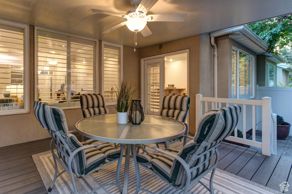 Dining area featuring wood finished floors and ceiling fan