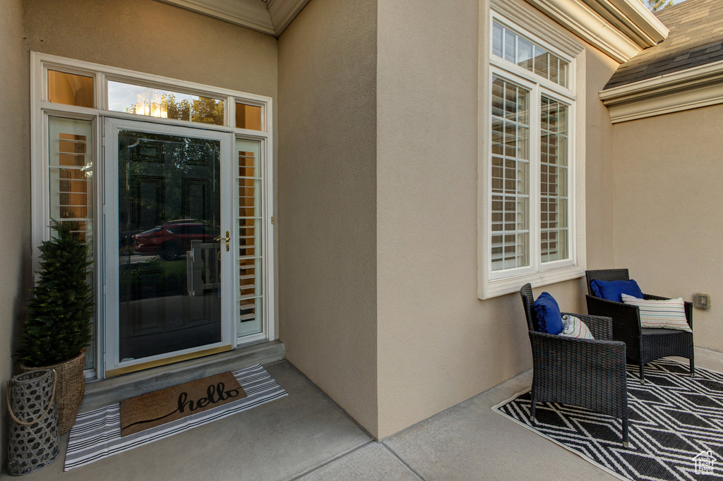 Doorway to property with stucco siding