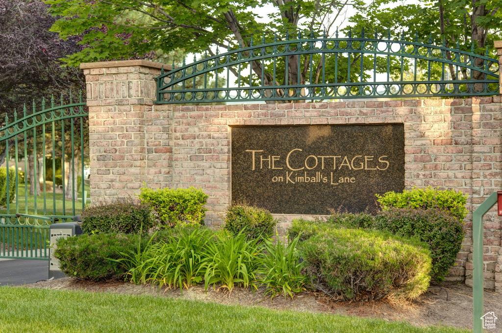 Community sign featuring a gate