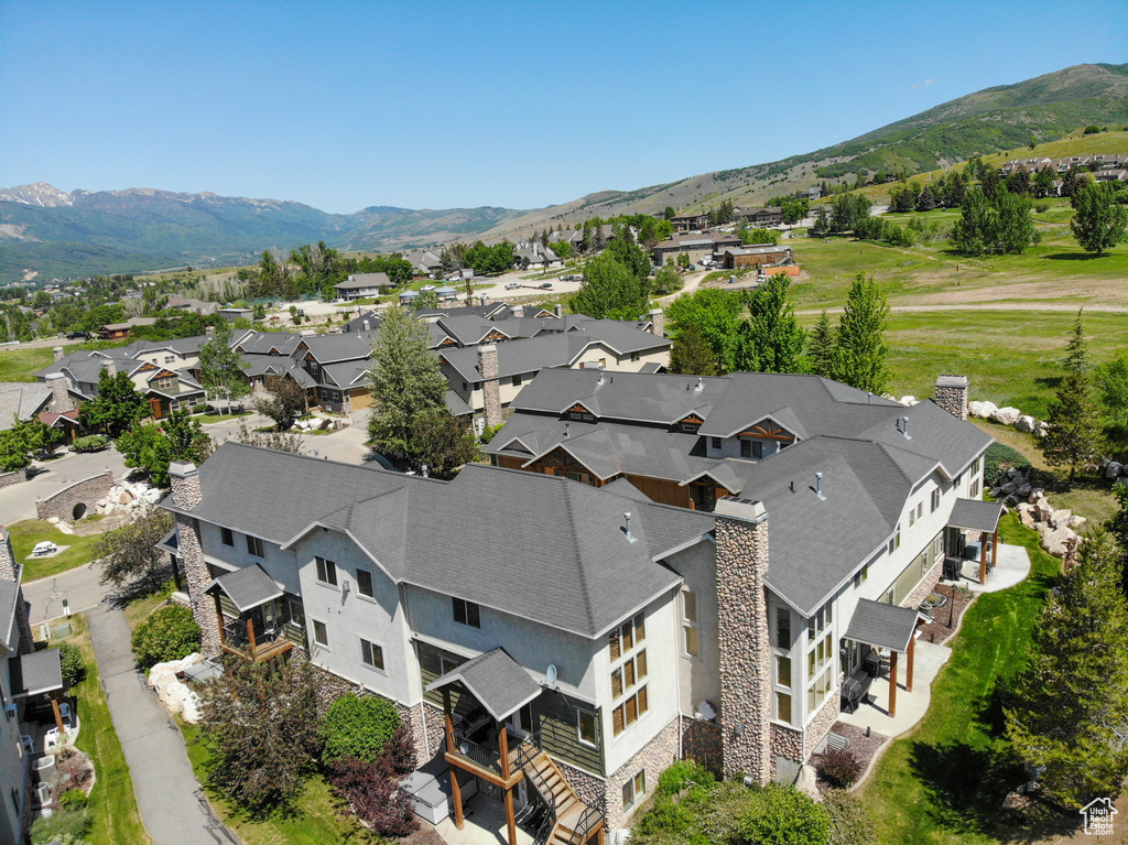 Aerial view of residential area with a mountainous background