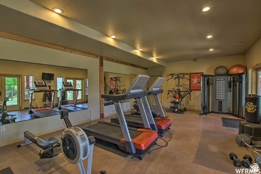 Gym with recessed lighting and baseboards