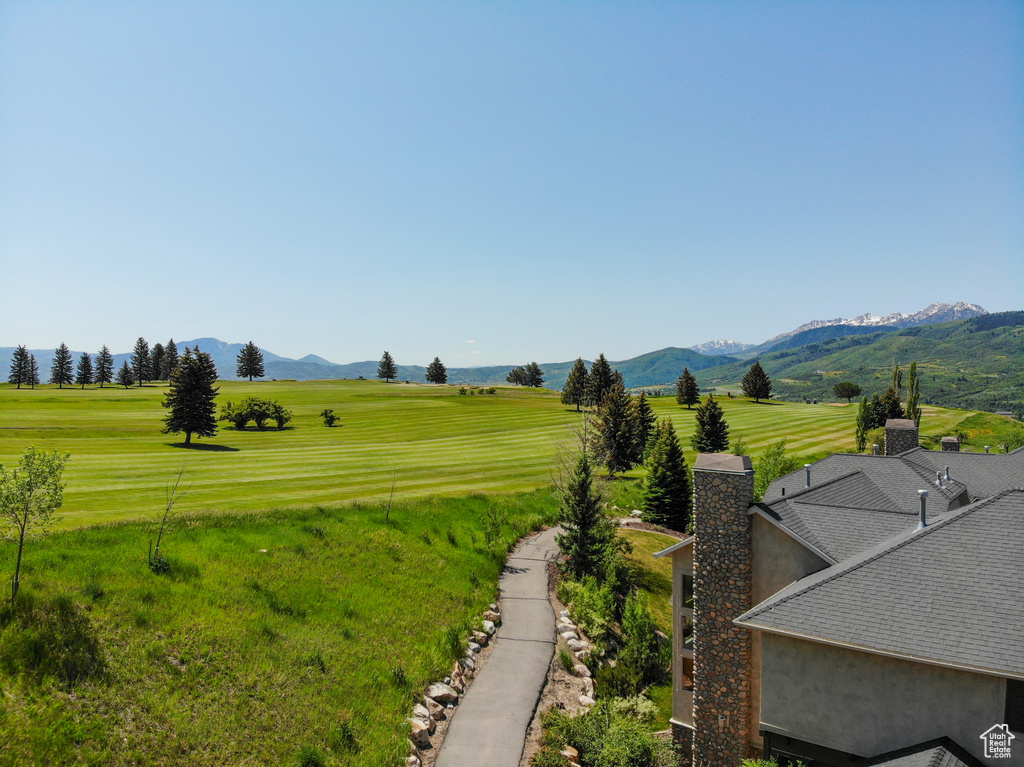 View of green lawn with a mountain view