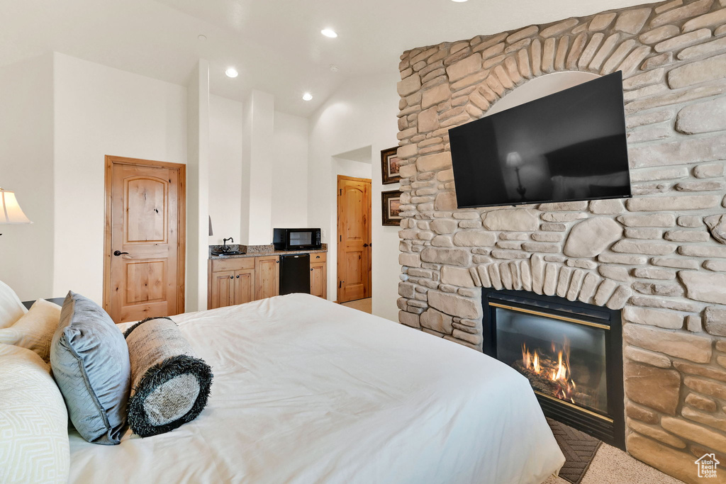 Bedroom with a fireplace and recessed lighting