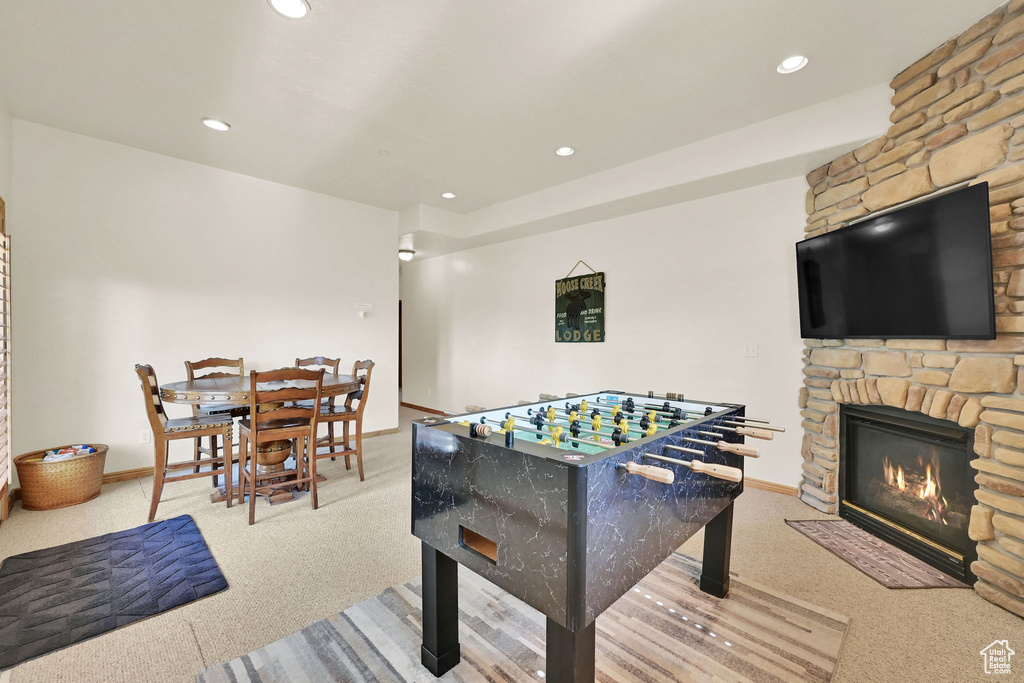 Game room featuring carpet, a fireplace, and recessed lighting