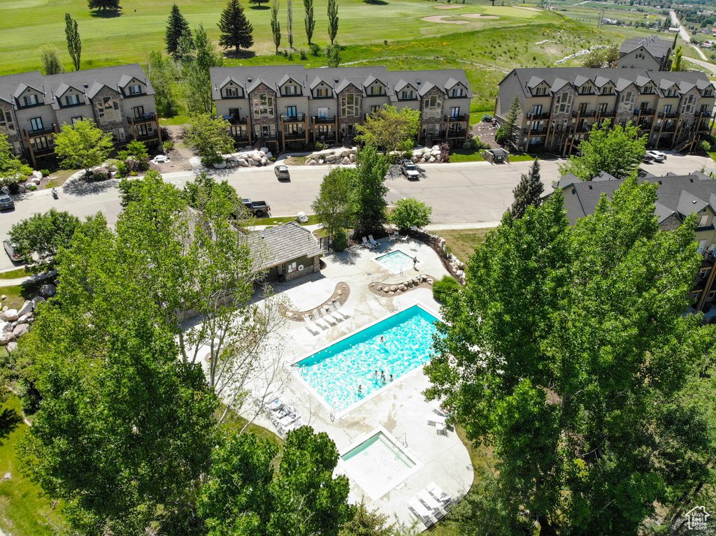 Aerial view of residential area featuring a local golf course