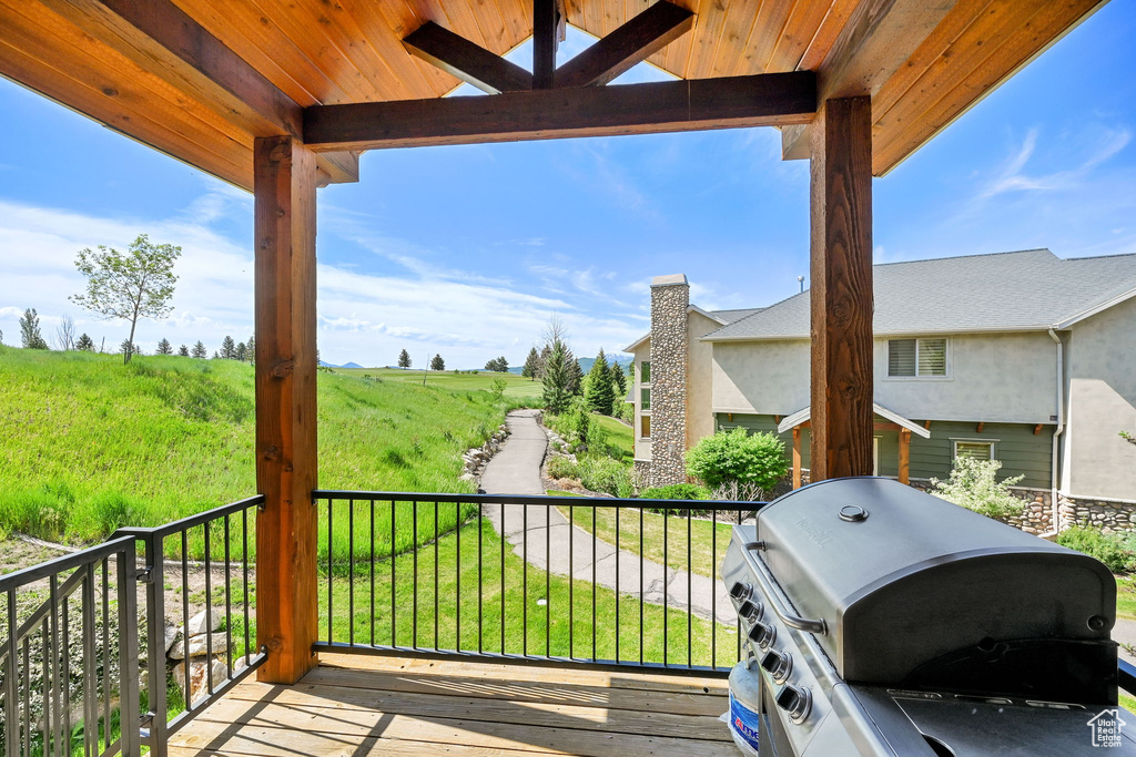 Wooden deck featuring grilling area