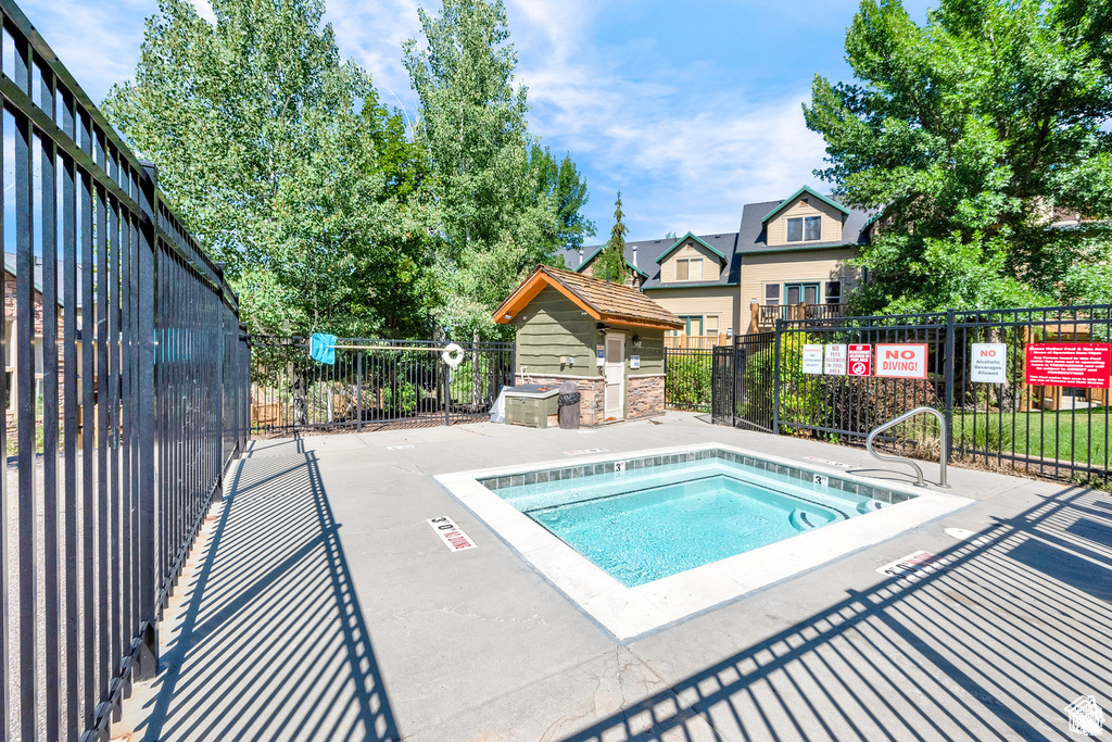 View of pool featuring a hot tub