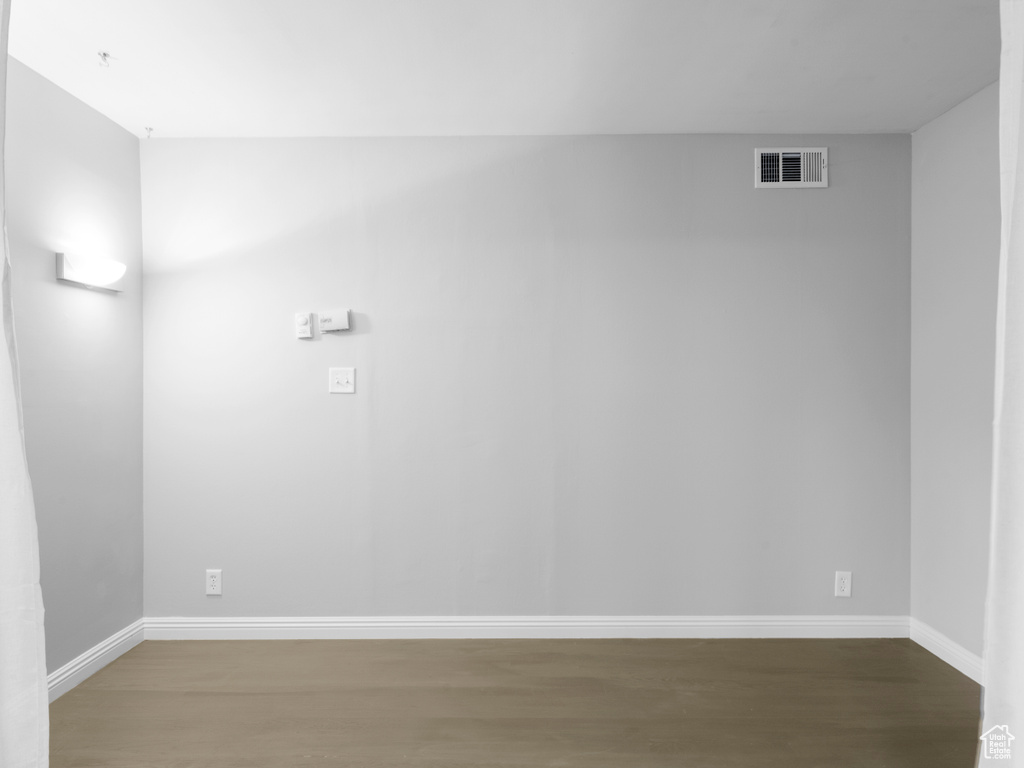Spare room with wood finished floors