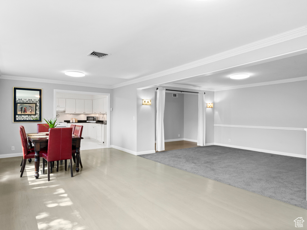 Dining room featuring ornamental molding