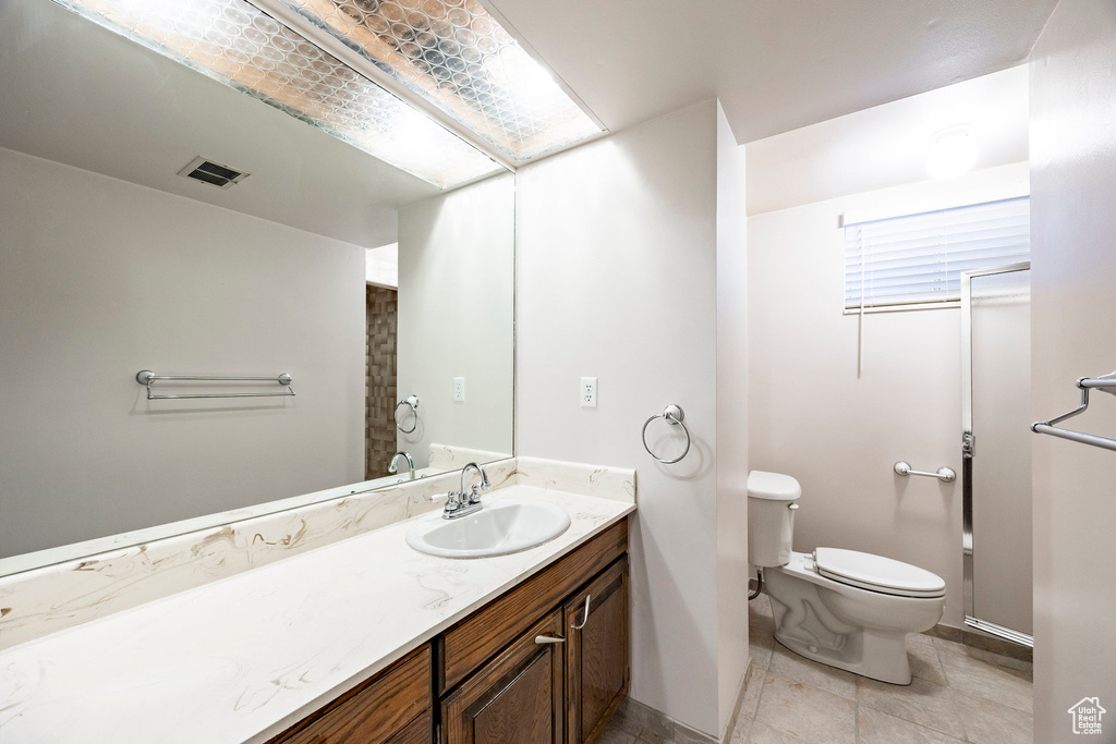 Full bathroom with vanity and tile patterned flooring