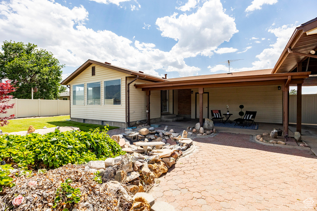 Rear view of house with a patio area