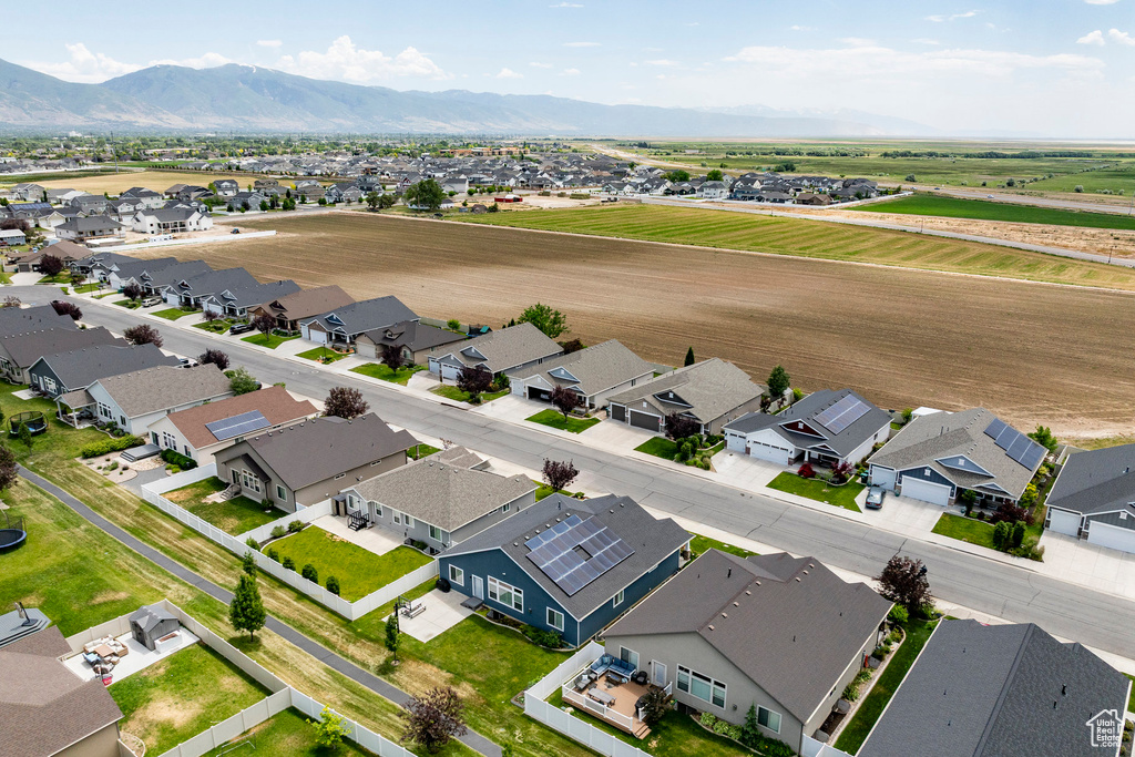 Aerial view of residential area featuring a mountain backdrop