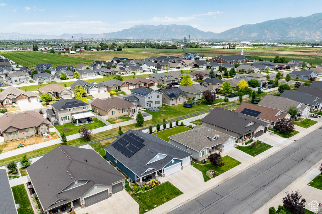 Aerial perspective of suburban area featuring a mountainous background
