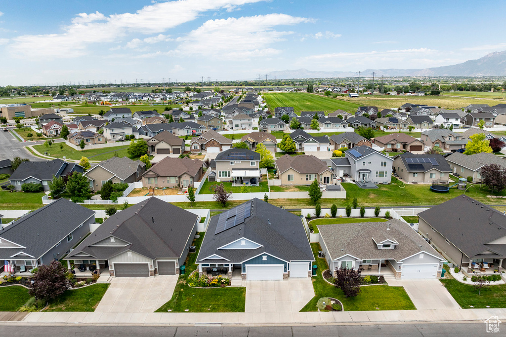 Aerial view of residential area featuring a mountain backdrop