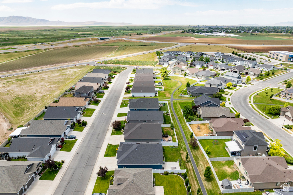 View of property location featuring nearby suburban area and a mountain backdrop