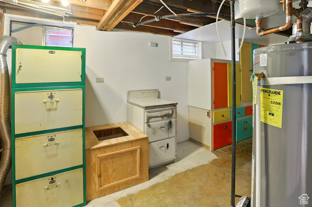 Below grade area featuring electric water heater