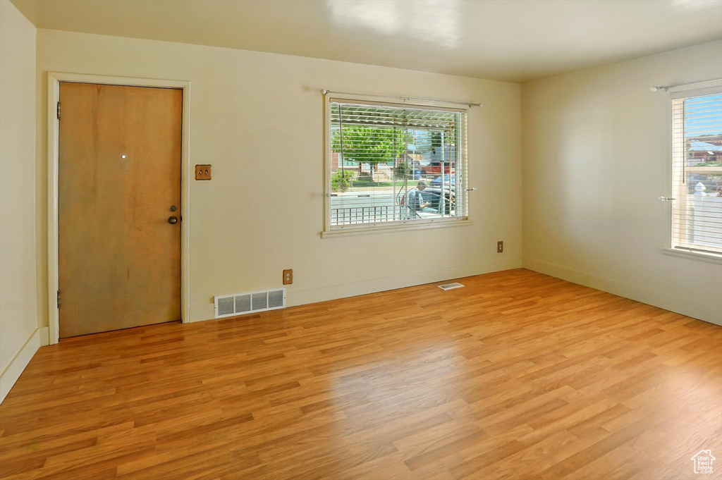 Unfurnished room featuring light wood-style floors