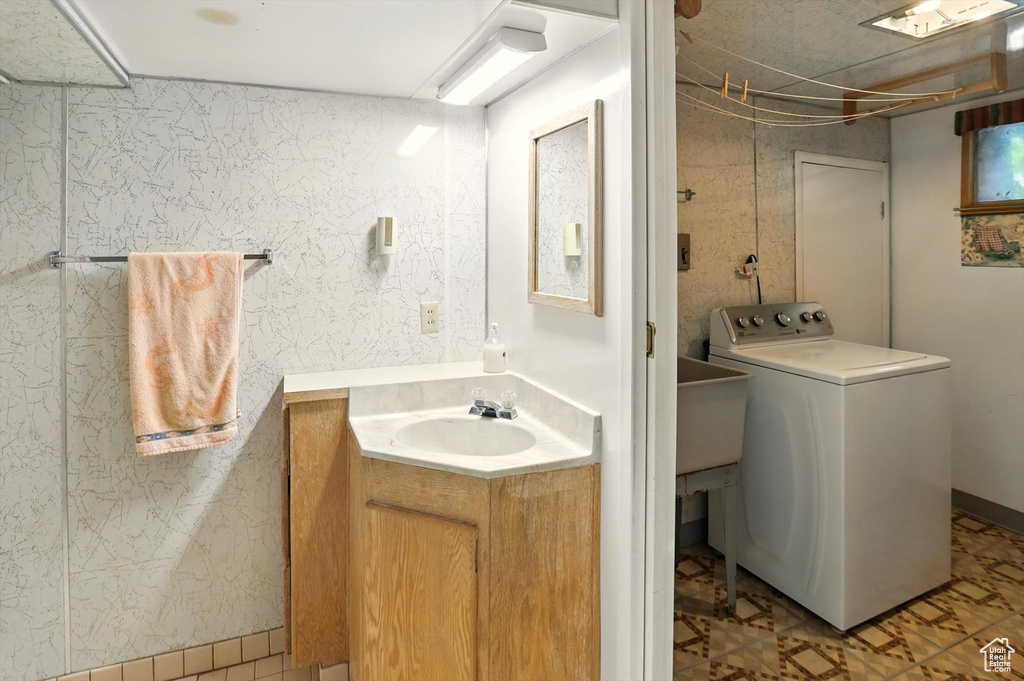 Bathroom with washer / dryer and vanity