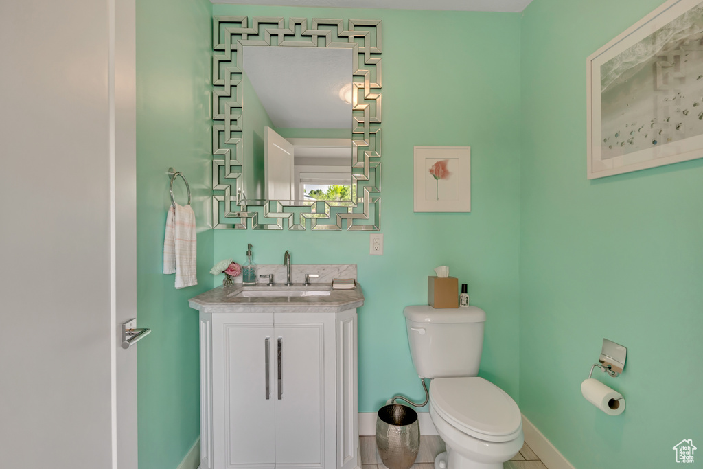 Bathroom with vanity and tile patterned floors