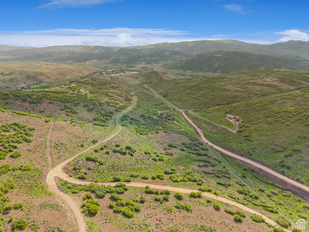 View of property location featuring a mountainous background and rural landscape