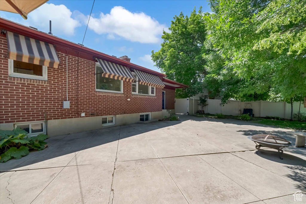 View of home\'s exterior with brick siding and a patio