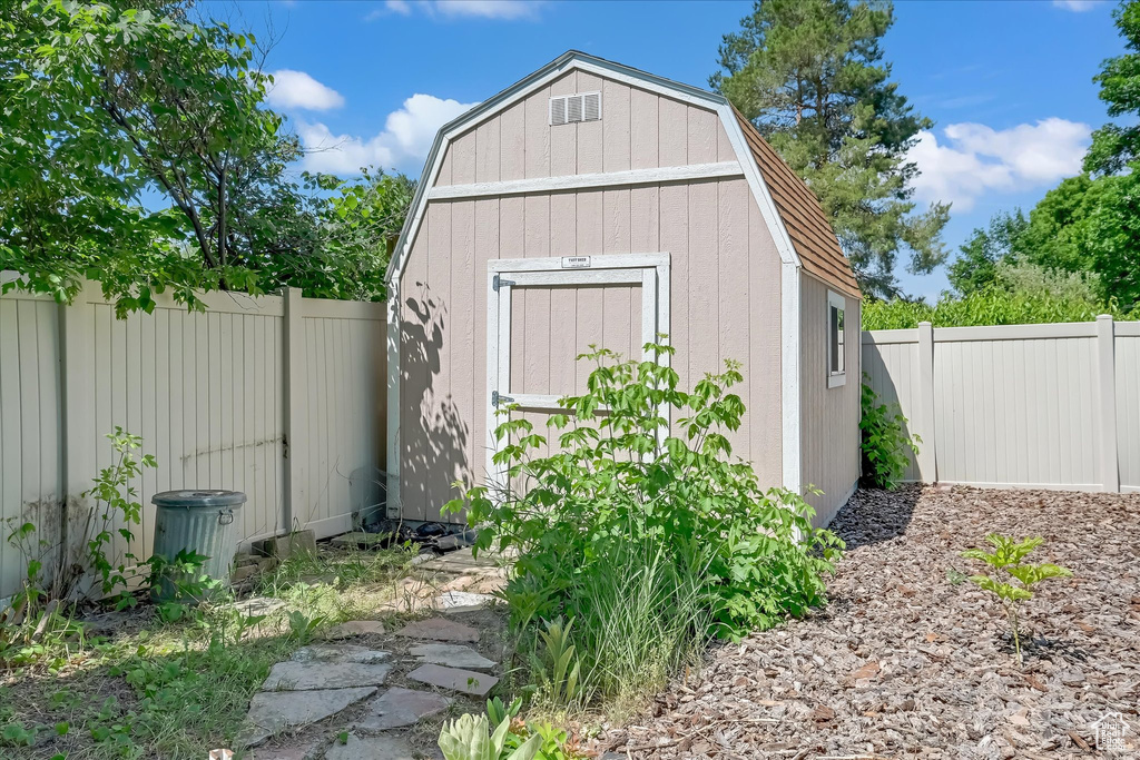 View of shed featuring a fenced backyard