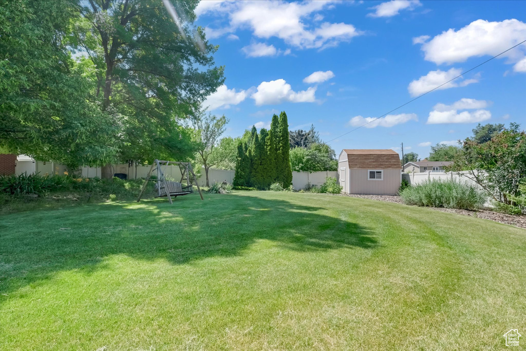 Fenced yard with a storage shed