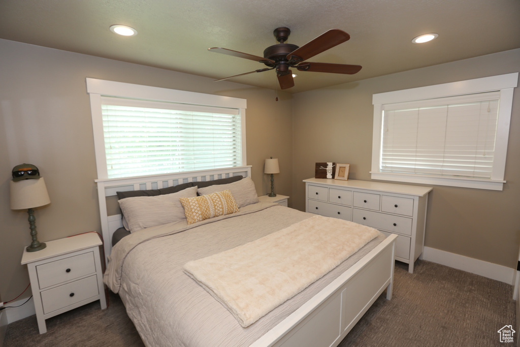 Bedroom featuring dark carpet, recessed lighting, and a ceiling fan