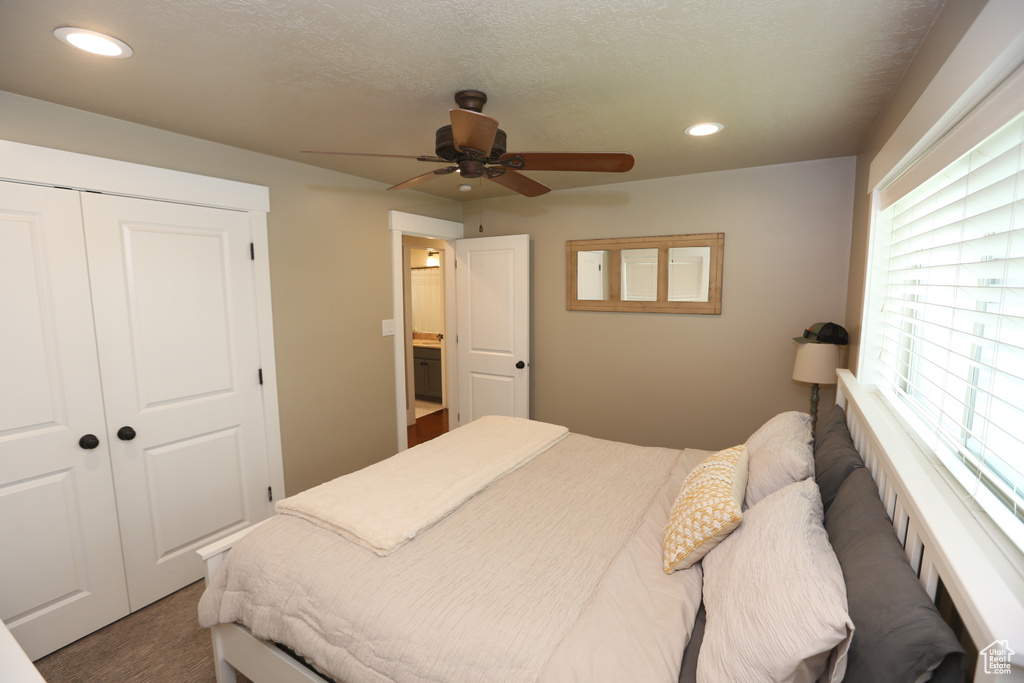 Carpeted bedroom with recessed lighting, a closet, and a ceiling fan