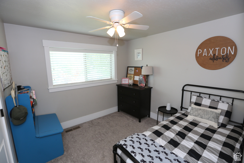 Bedroom featuring carpet floors and a ceiling fan