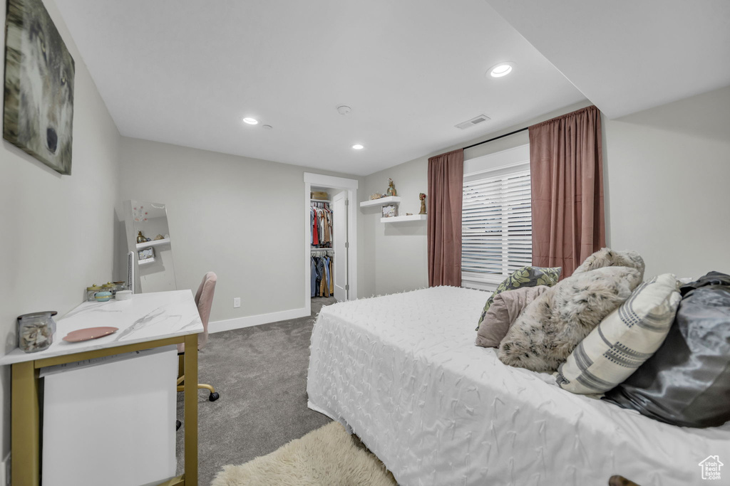Carpeted bedroom featuring recessed lighting, a spacious closet, and a closet