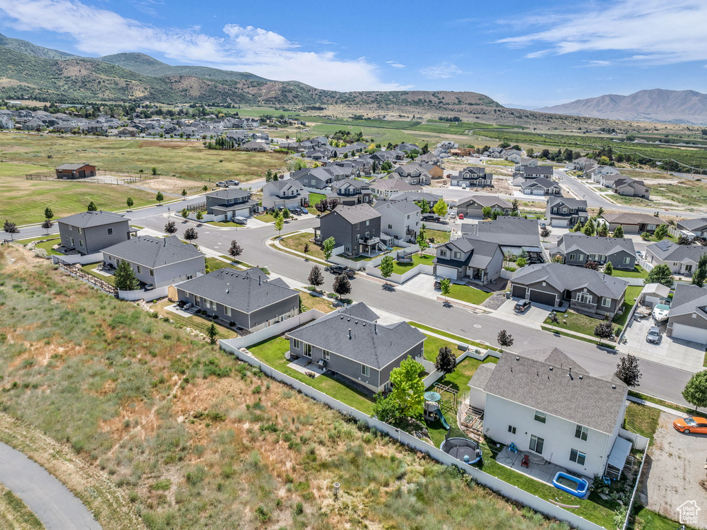 Aerial perspective of suburban area featuring a mountain backdrop