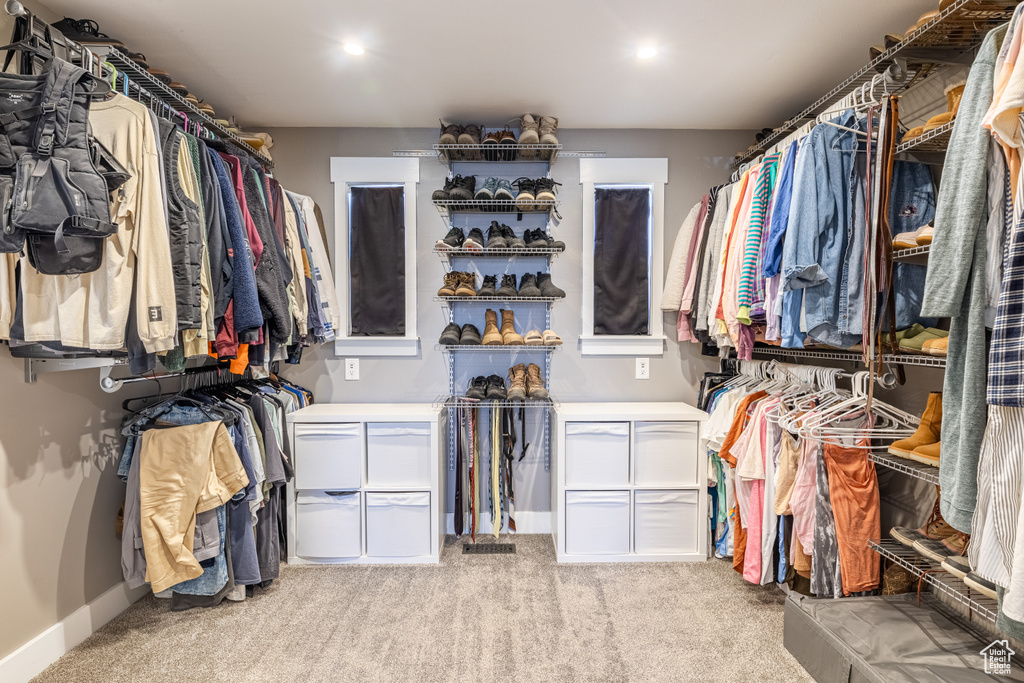 Spacious closet featuring carpet flooring