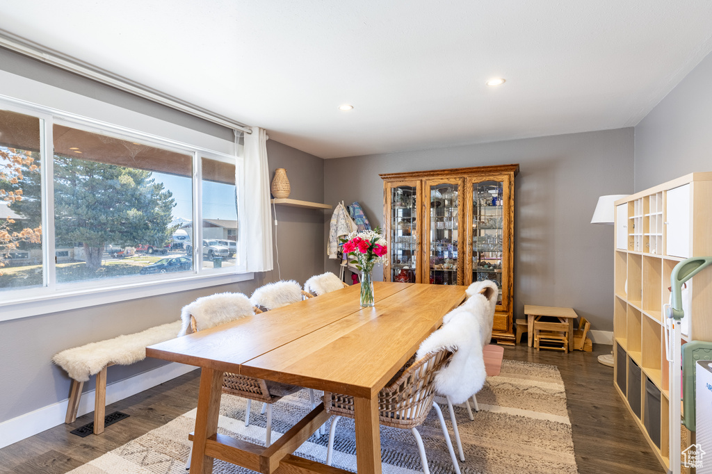 Dining room featuring wood finished floors and recessed lighting